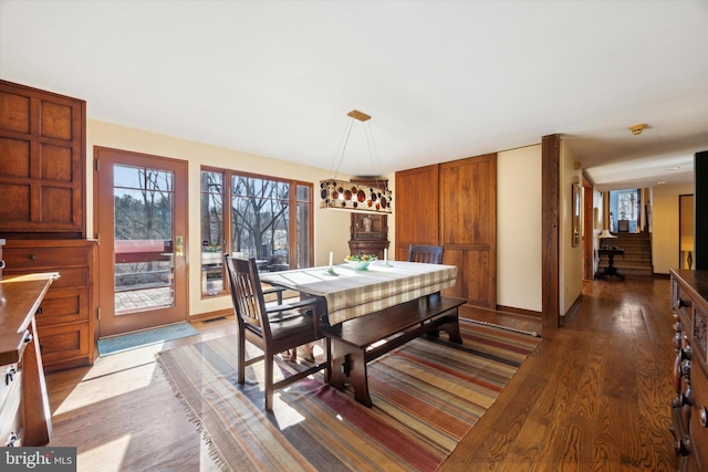 dining room with dark wood-type flooring