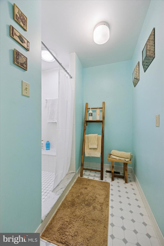 bathroom with a shower with shower curtain