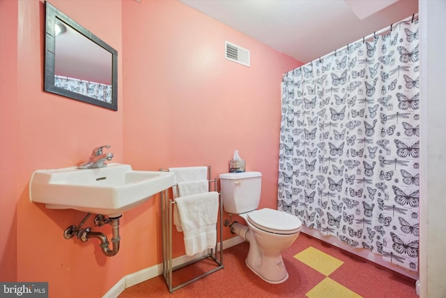 bathroom with sink and toilet