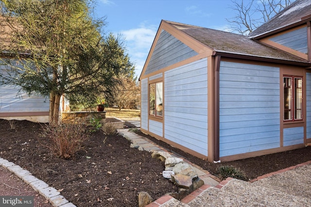 view of home's exterior featuring an outdoor structure