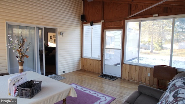 sunroom / solarium with plenty of natural light and lofted ceiling