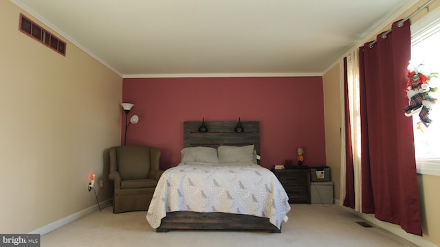 bedroom with carpet floors and ornamental molding