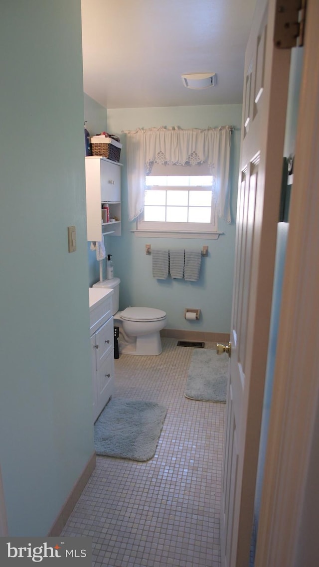 bathroom with vanity and toilet