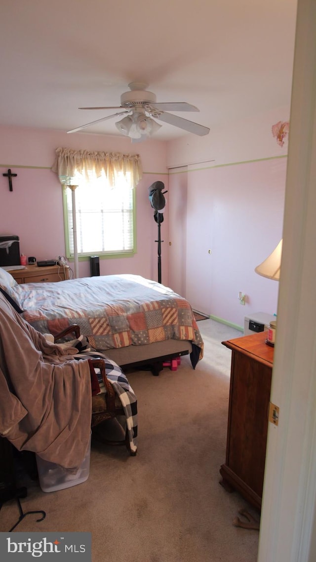 carpeted bedroom with ceiling fan