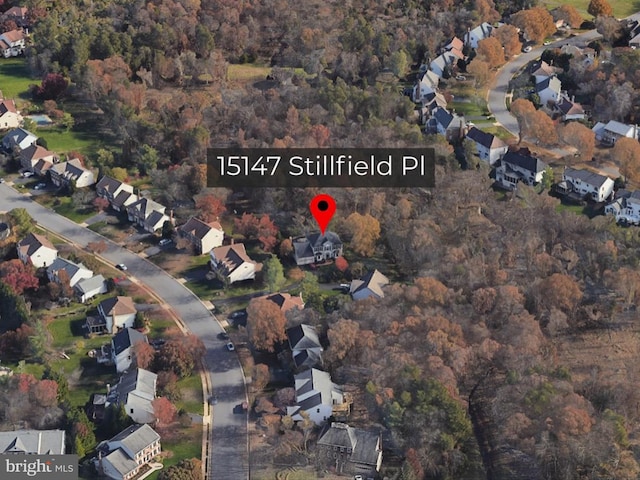 birds eye view of property with a residential view