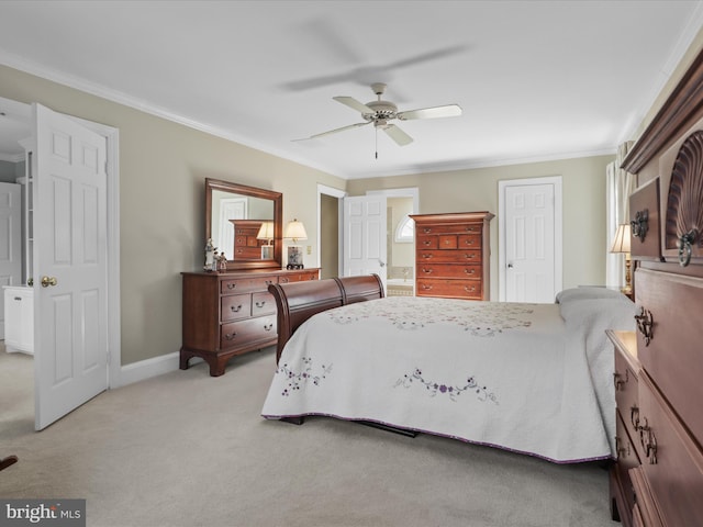 bedroom featuring baseboards, a ceiling fan, connected bathroom, light colored carpet, and crown molding