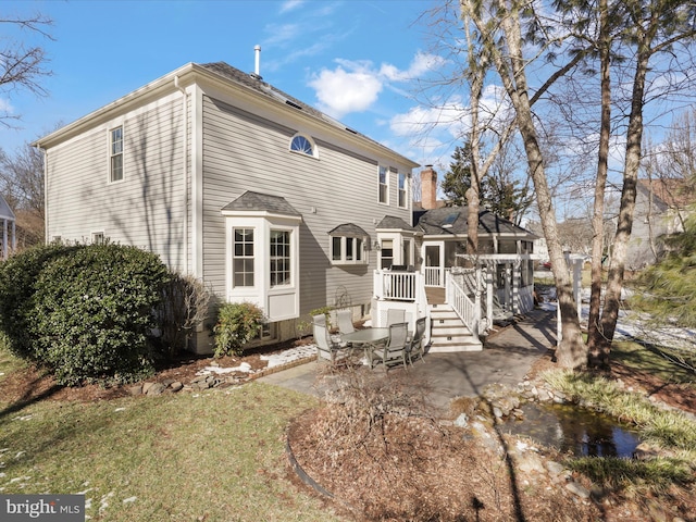 back of house with a patio