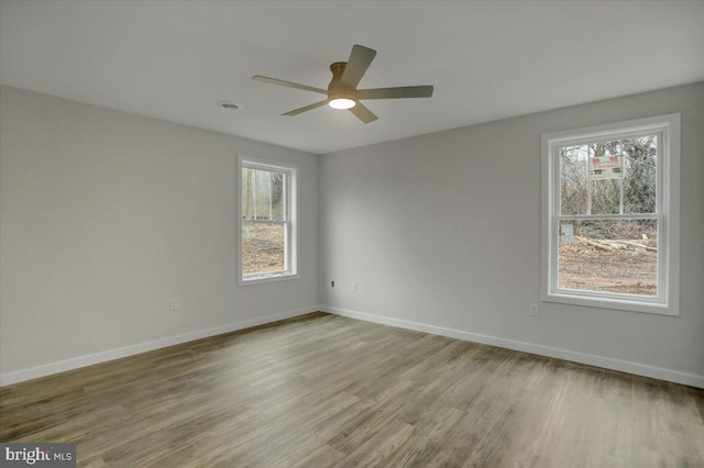 empty room featuring ceiling fan and light wood-type flooring