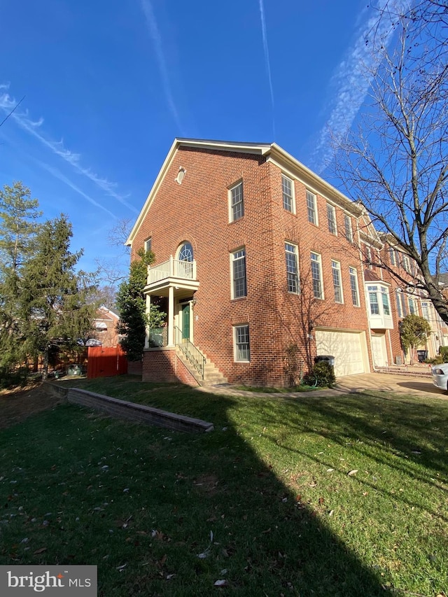 view of side of home featuring a yard and a garage