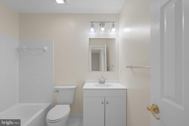 full bathroom featuring vanity, tiled shower / bath, and toilet