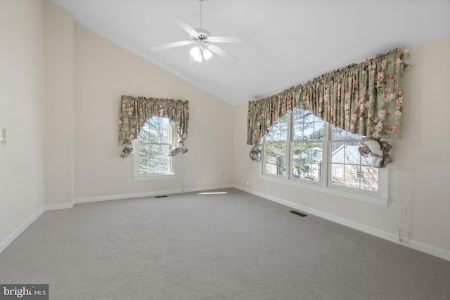 unfurnished room with lofted ceiling, ceiling fan, and carpet