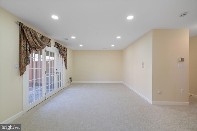 empty room featuring light carpet