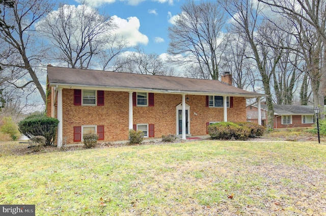 raised ranch featuring a front yard