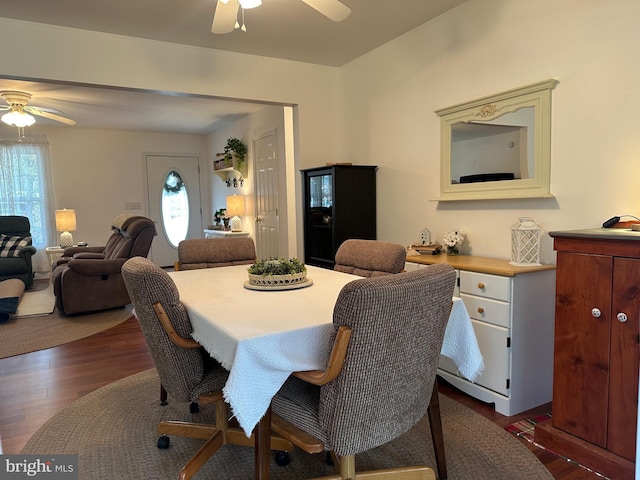 dining room featuring ceiling fan and dark hardwood / wood-style flooring