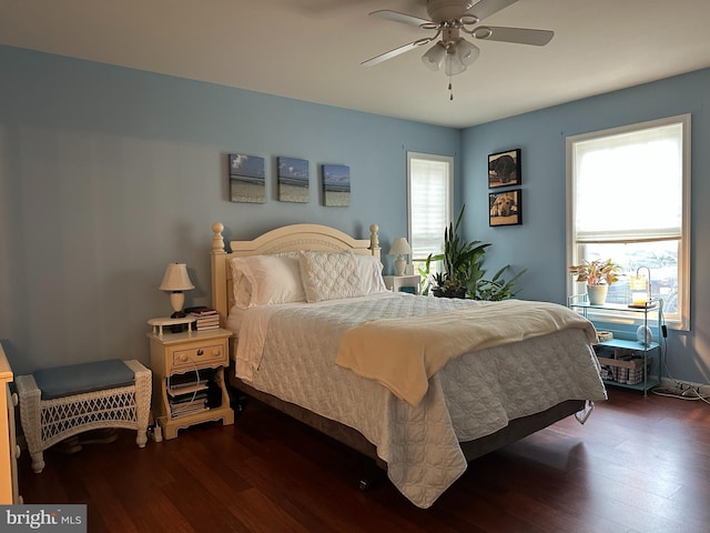 bedroom with ceiling fan and dark wood-type flooring