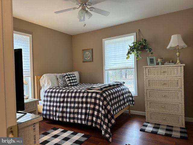 bedroom featuring ceiling fan and dark hardwood / wood-style flooring