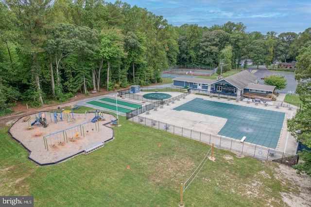 view of swimming pool featuring a lawn