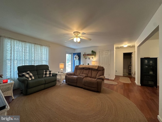 living room with ceiling fan and hardwood / wood-style floors