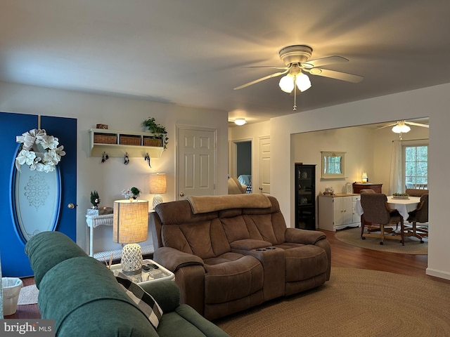 living room featuring hardwood / wood-style flooring and ceiling fan