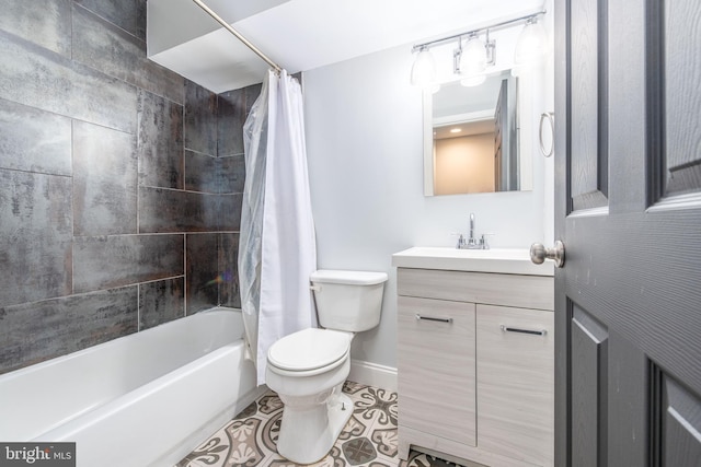 full bathroom featuring tile patterned floors, shower / bath combo with shower curtain, vanity, and toilet