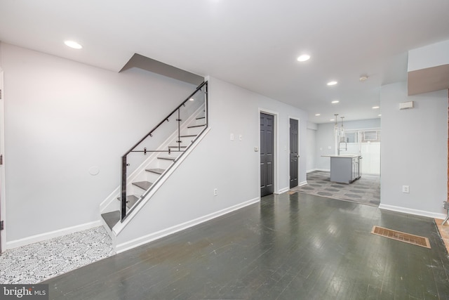 interior space featuring sink and dark wood-type flooring