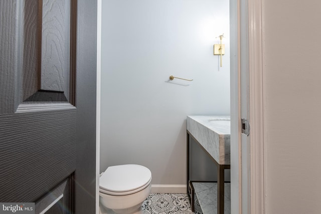 bathroom with tile patterned floors and toilet