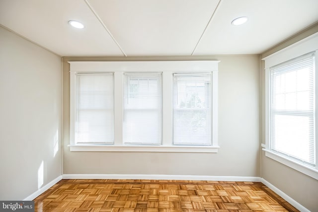 spare room with plenty of natural light