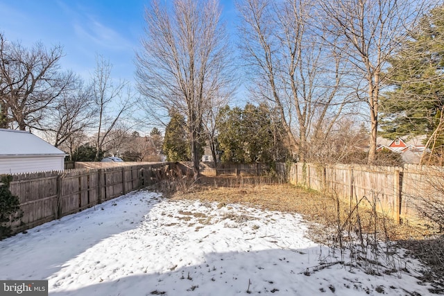 view of yard covered in snow