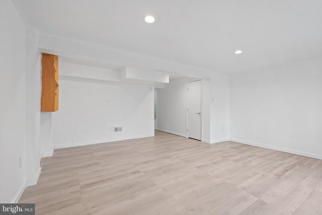 spare room with light hardwood / wood-style floors