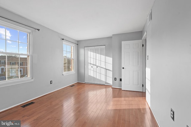 spare room with light hardwood / wood-style flooring