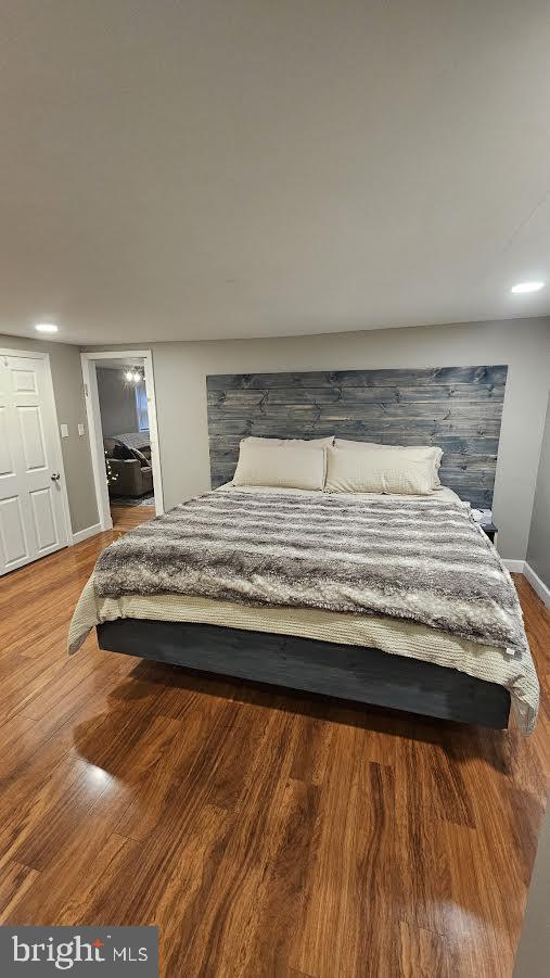 bedroom featuring wood-type flooring