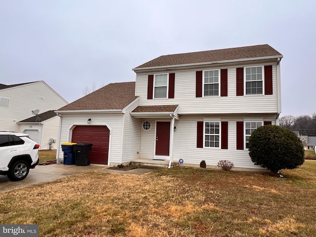 view of front facade with a front yard and a garage