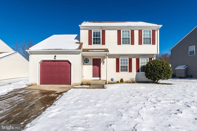 front of property with a garage