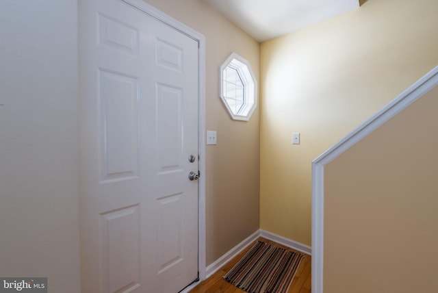 doorway with hardwood / wood-style floors