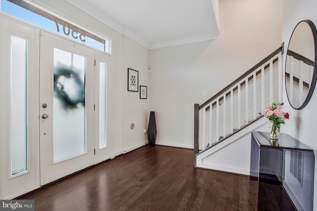 foyer entrance featuring dark hardwood / wood-style flooring and crown molding