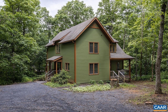 view of property exterior with covered porch