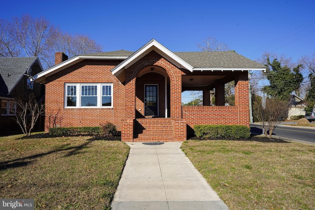 bungalow-style house featuring a front yard