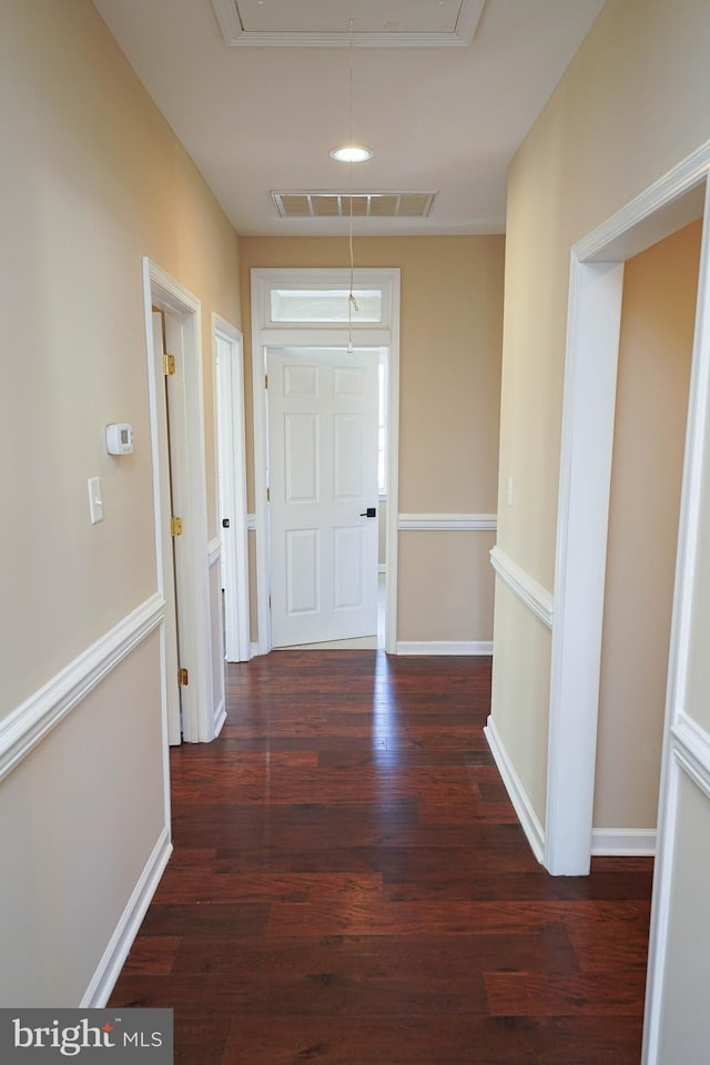 corridor featuring dark hardwood / wood-style flooring