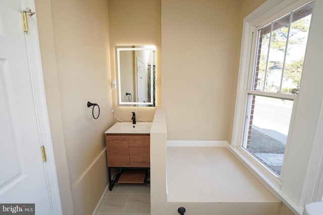 bathroom featuring tile patterned flooring and vanity