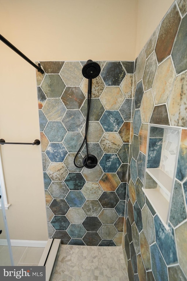 bathroom featuring a shower and tile patterned floors