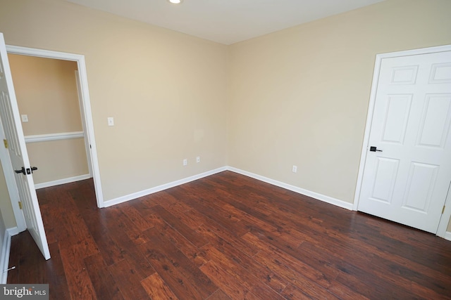 empty room featuring dark hardwood / wood-style floors