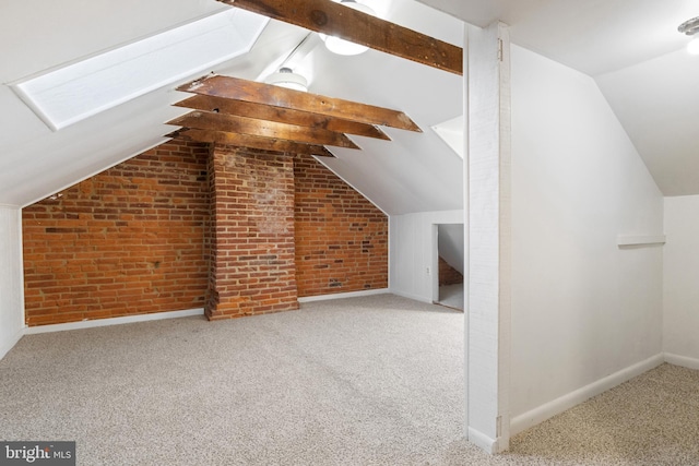 bonus room with carpet flooring, vaulted ceiling with beams, and brick wall