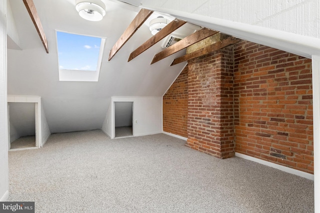 bonus room featuring carpet floors, brick wall, and vaulted ceiling