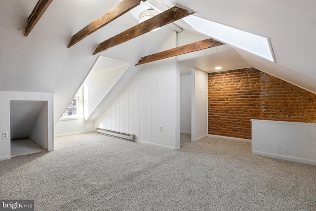 additional living space featuring vaulted ceiling with beams, light carpet, brick wall, and a baseboard heating unit