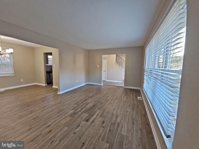 interior space with hardwood / wood-style floors and a notable chandelier