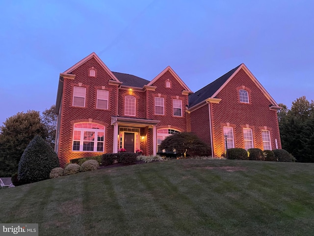 view of front of property with a lawn