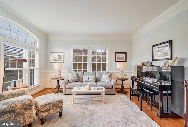 living room with hardwood / wood-style floors and ornamental molding