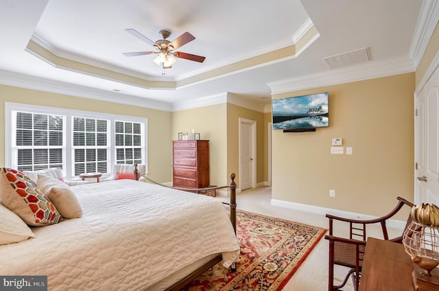 bedroom featuring carpet flooring, ceiling fan, a raised ceiling, and crown molding