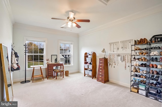 interior space with ceiling fan and ornamental molding