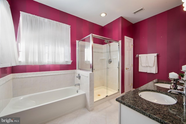 bathroom featuring separate shower and tub, tile patterned floors, and vanity